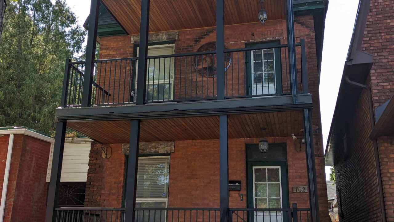 Three-storey composite deck with finished railing