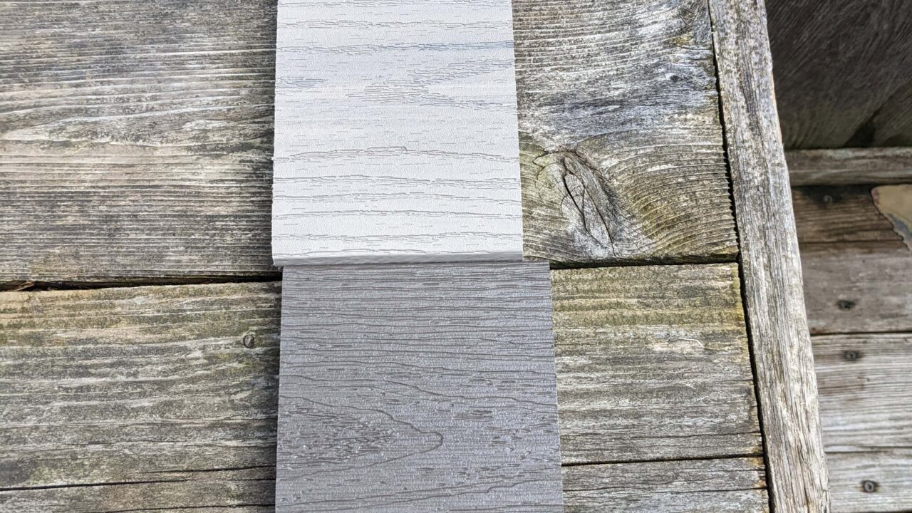 Composite decking installed beside older pressure-treated deck boards