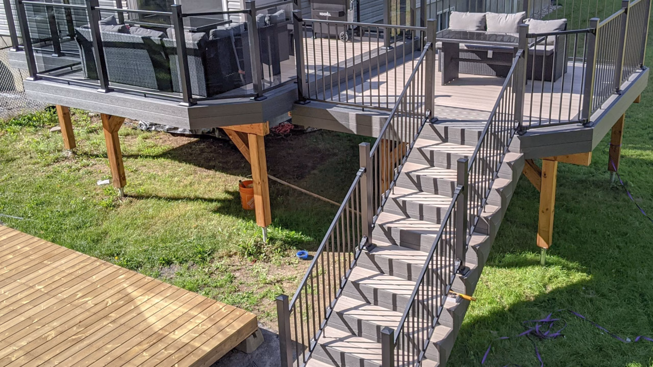 Finished Kanata deck with Fiberon Cabana decking, Earl Grey trim, and black Fortress railing