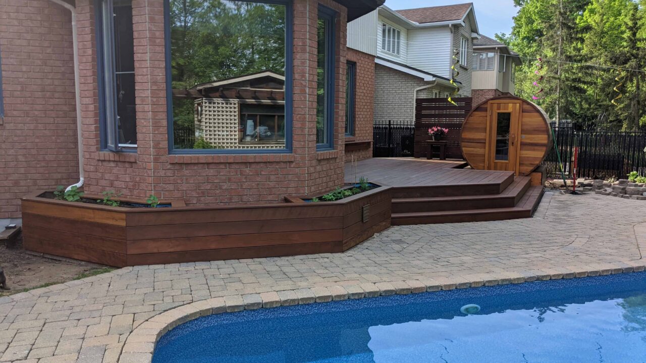 Oiled IPE planters beside a poolside deck in Kanata